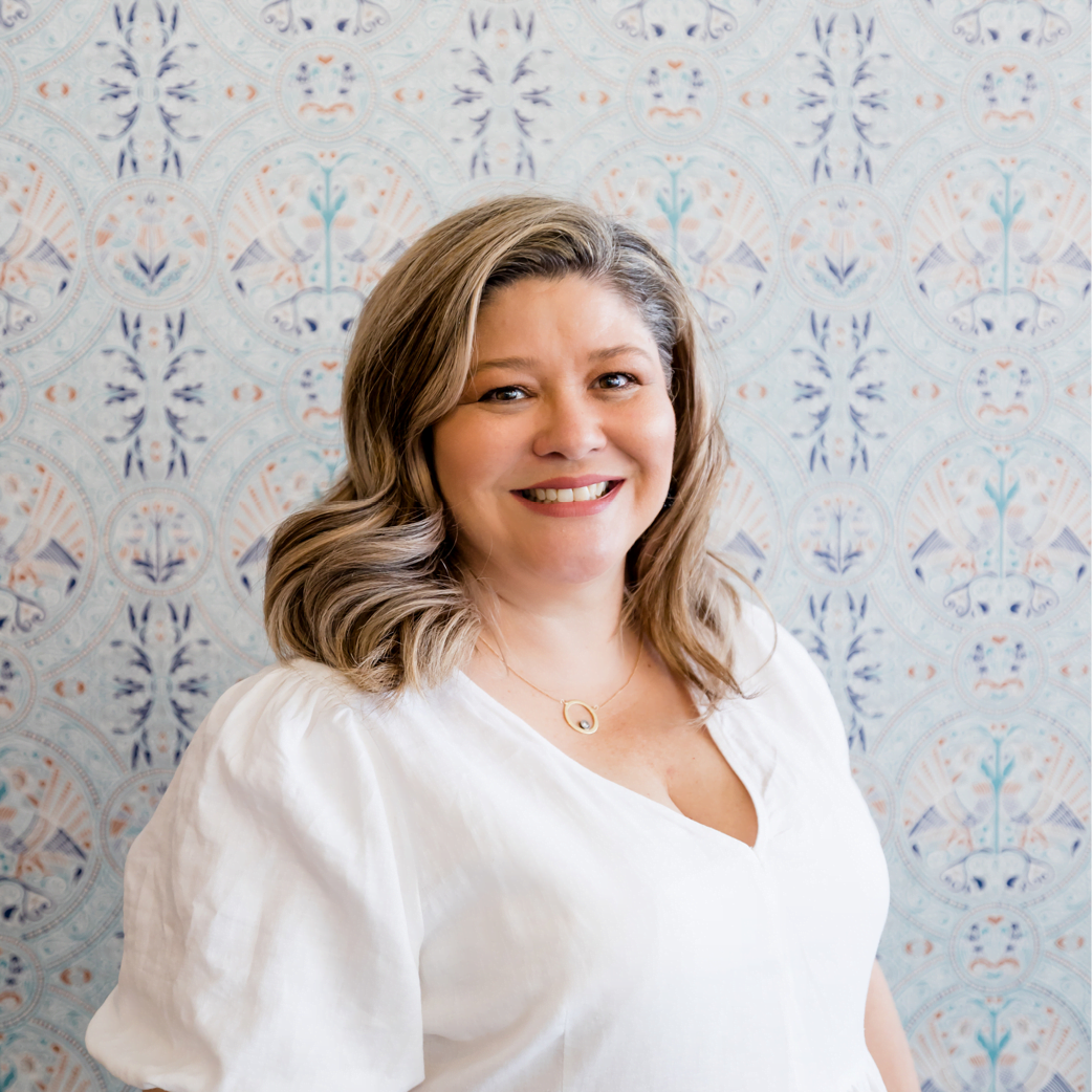 Madeleine Fisher, founder of Solo Tú, smiling in her Orange NSW studio