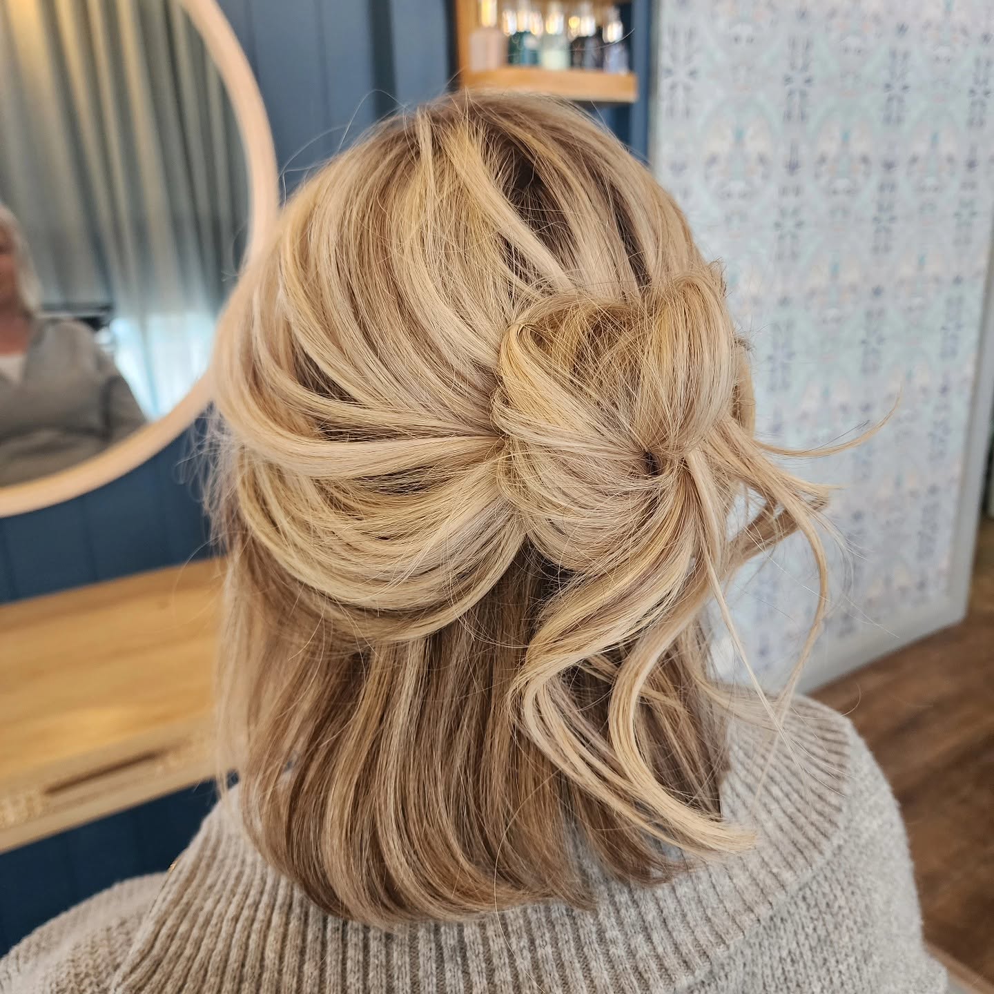Blonde half-up textured updo